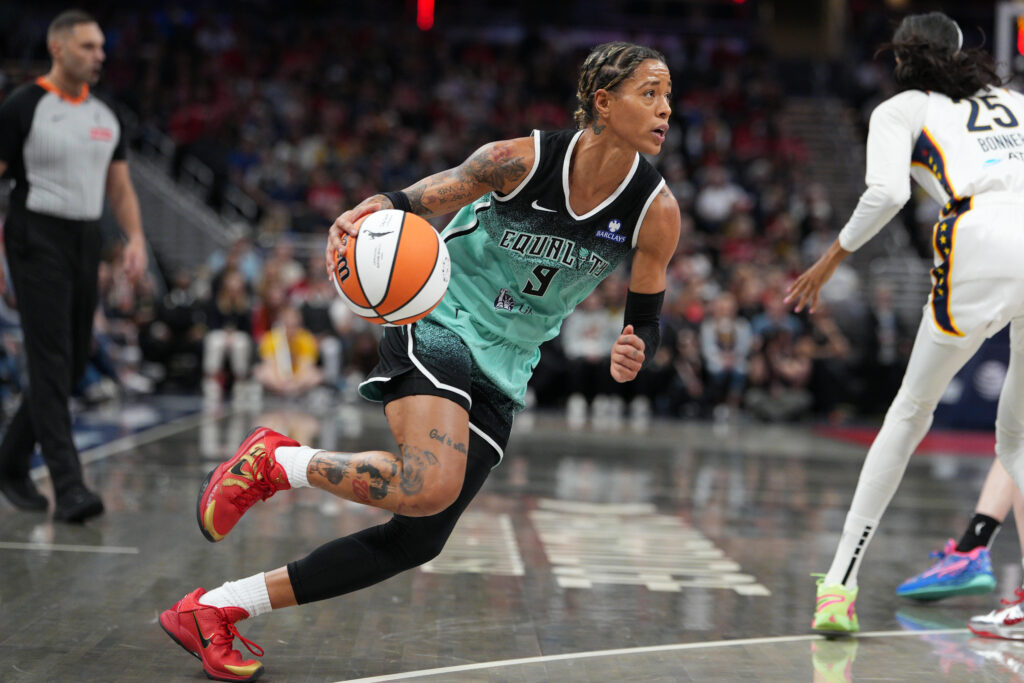 2025 Liberty addition Natasha Cloud dribbles the ball during a WNBA game.