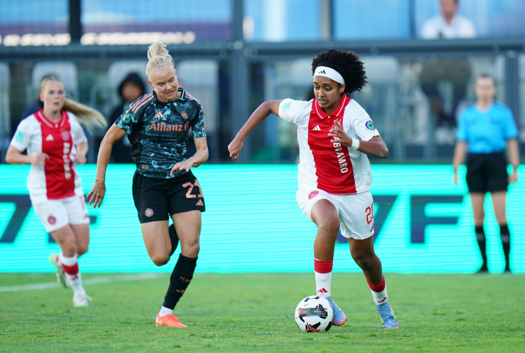 Ajax's Lily Yohannes dribbles away from Bayern Munich's Pernille Harder during the inaugural W7F tournament.