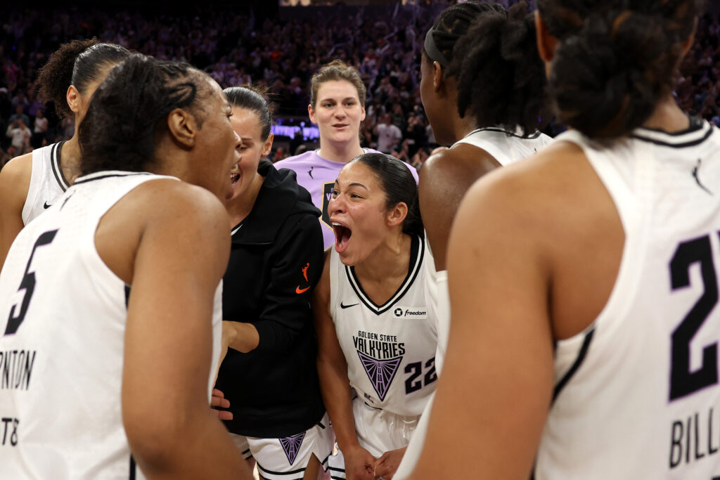 Veronica Burton celebrates the first-ever Valkyries win with her teammates.
