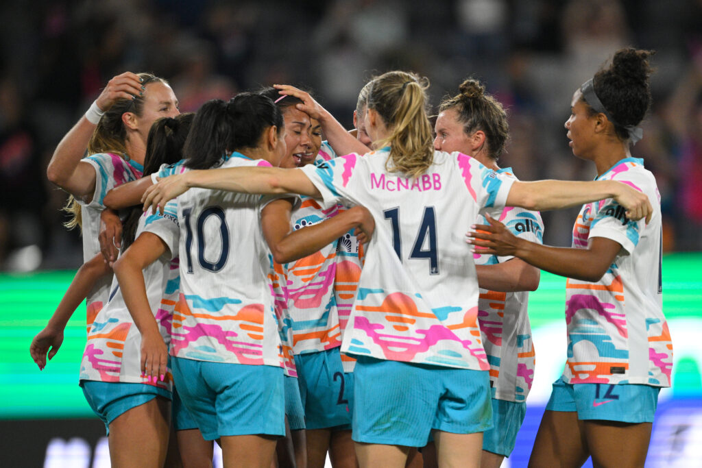 San Diego Wave FC's María Sánchez celebrates her goal with teammates during a 2025 NWSL match.