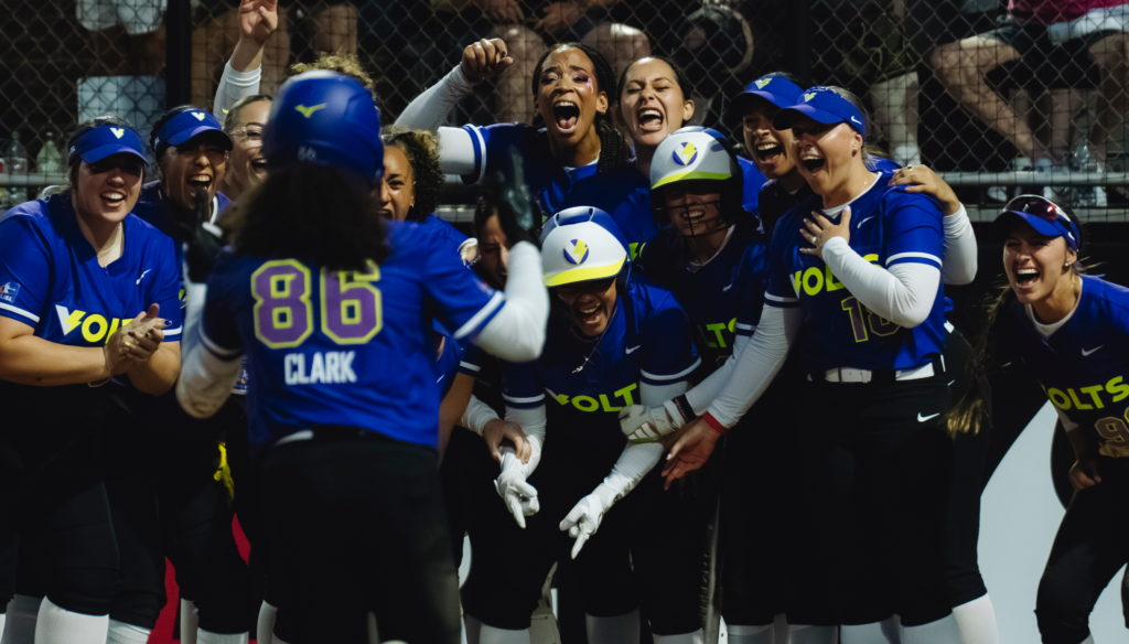 The Volts celebrate McKenzie Clark's extra-inning home run.