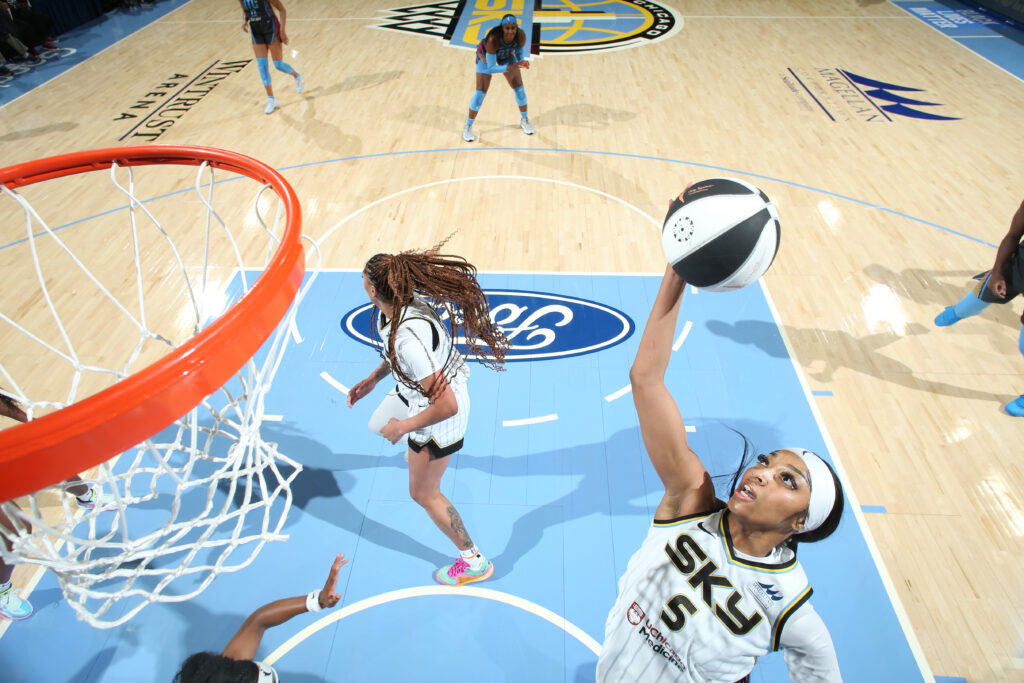 Chicago Sky star Angel Reese grabs a rebound during a 2024 WNBA game.