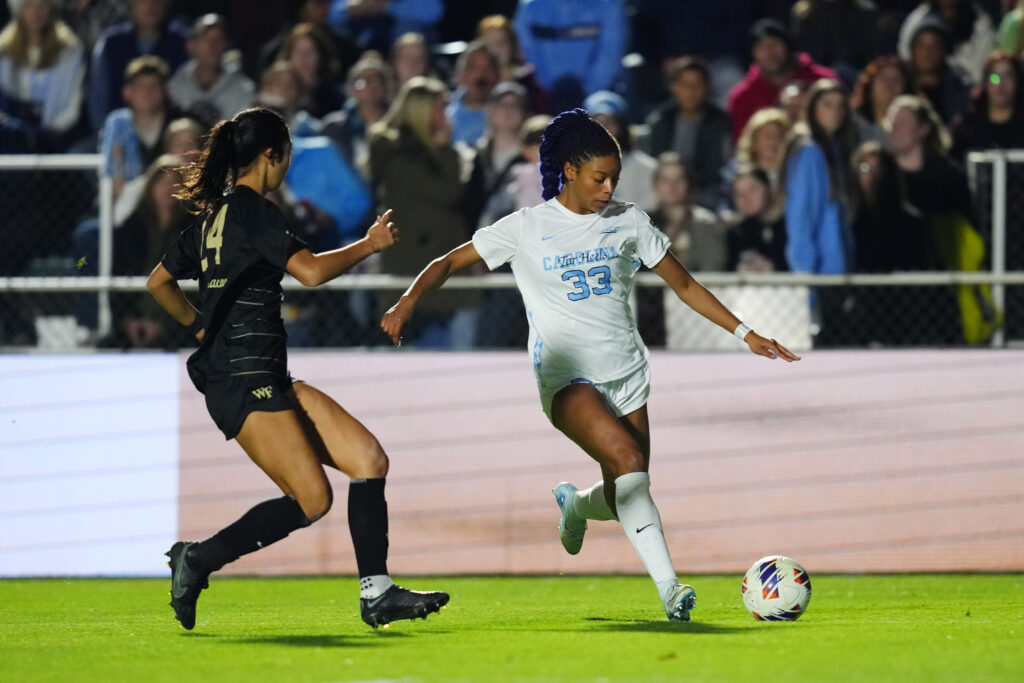 UNC's Olivia Thomas dribbles past Wake Forest's Zara Chavoshi during the 2024 NCAA championship.