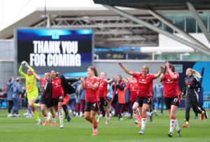 Manchester United players celebrate their 2025 FA Cup semifinal win over Manchester City.