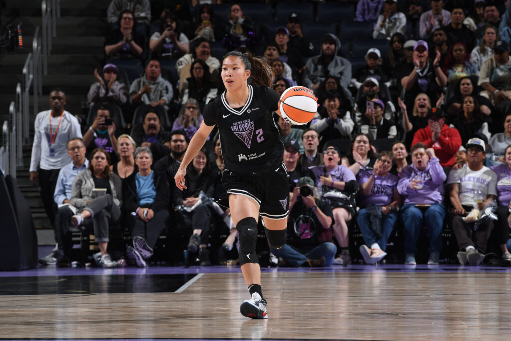 Golden State Valkyries rookie Kaitlyn Chen dribbles the ball up the court during a 2025 WNBA preseason game.