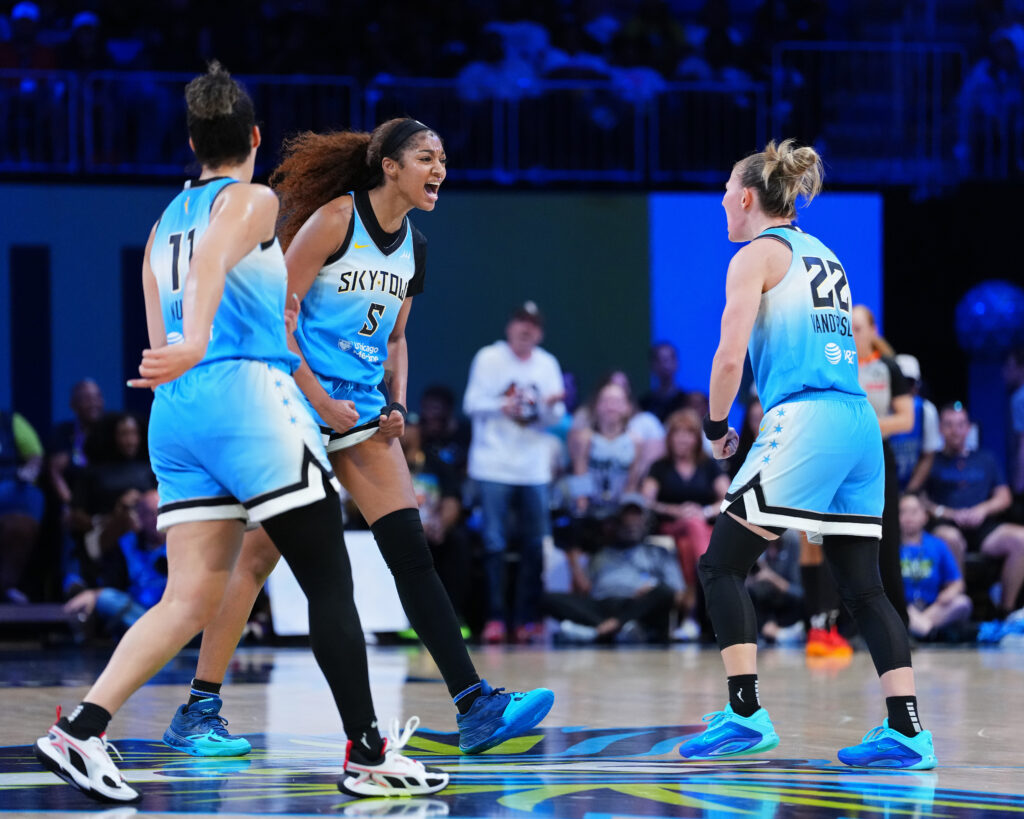 Chicago's Angel Reese and Courtney Vandersloot celebrate during a 2025 WNBA win.