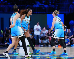 Chicago's Angel Reese and Courtney Vandersloot celebrate during a 2025 WNBA win.