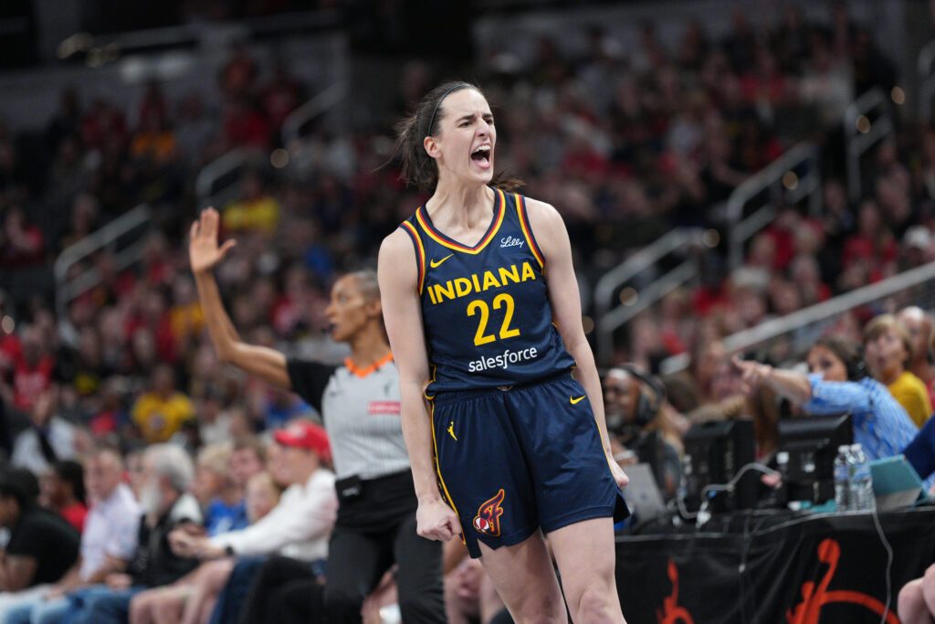 Indiana Fever guard Caitlin Clark celebrates a play during a 2025 WNBA game.