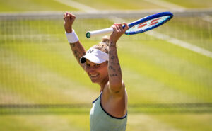 Czechia's Markéta Vondroušová raises her arms in celebration after her 2025 Berlin Open semifinals victory.