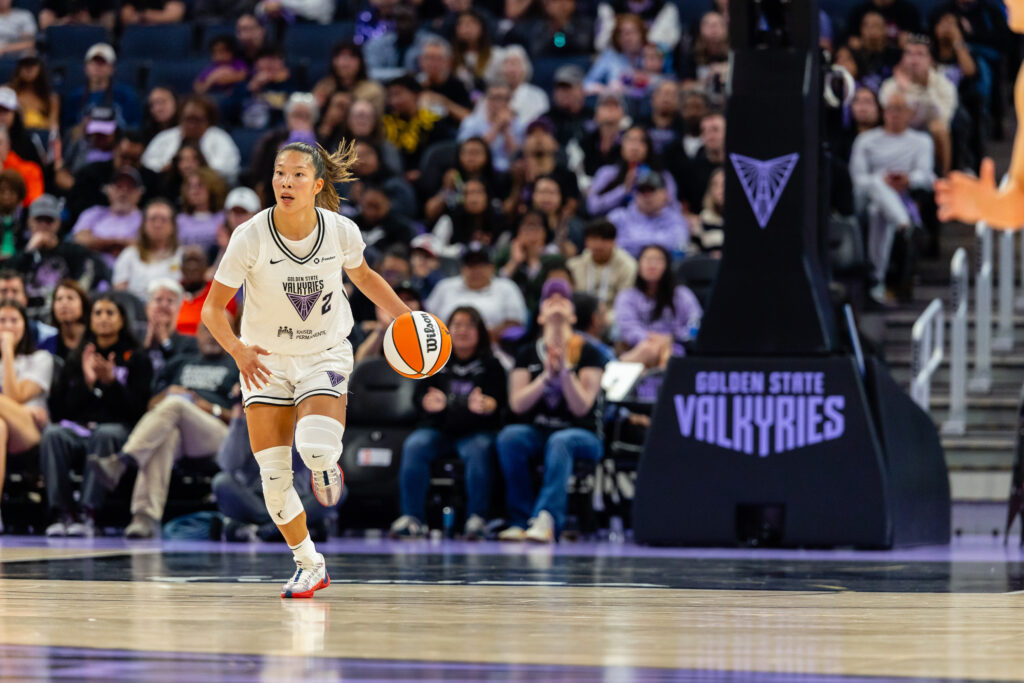 Golden State Valkyries guard Kaitlyn Chen dribbles the ball during a 2025 WNBA game.