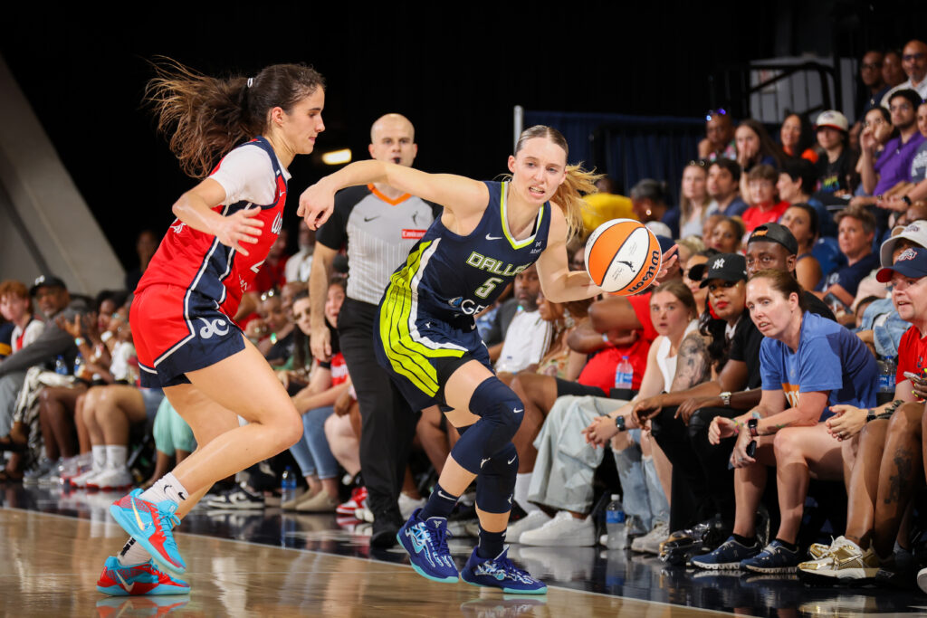 Washington Mystics rookie Sonia Citron guards Dallas Wings rookie Paige Bueckers during a 2025 WNBA game.