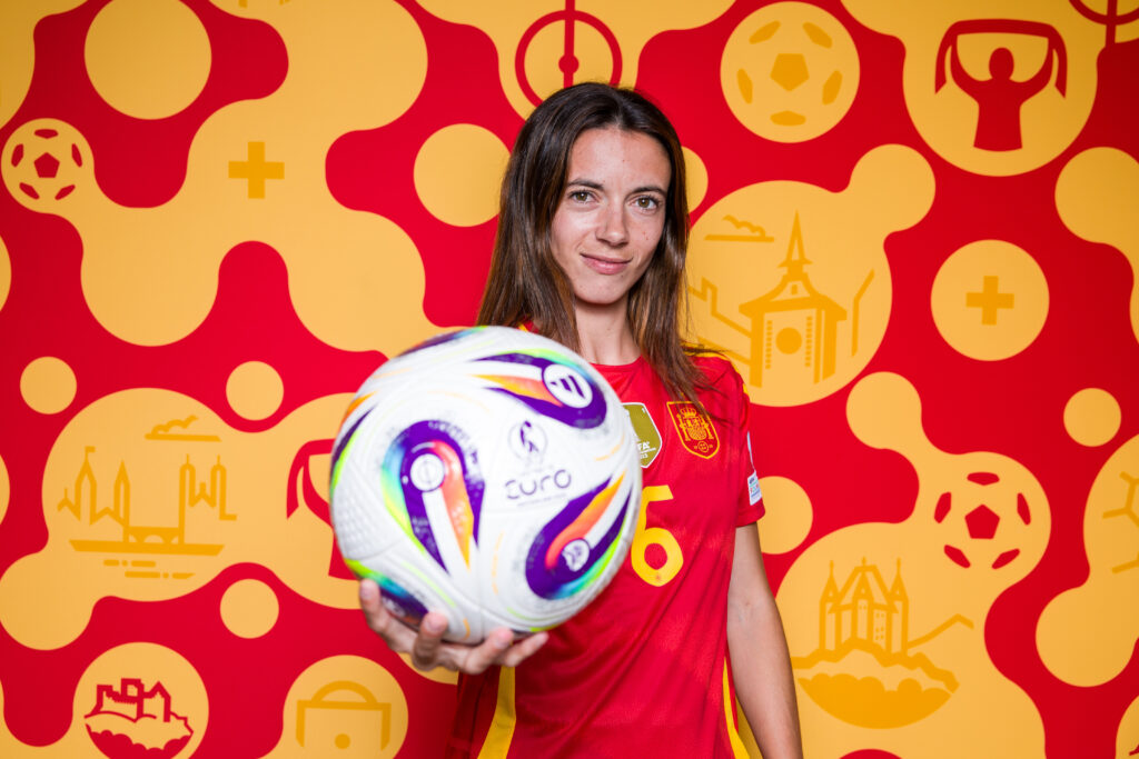 Spain star Aitana Bonmatí holds a soccer ball in an official 2025 Euro photo.