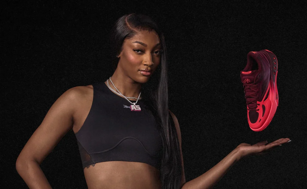 Angel Reese poses with a floating Reebok "Pretty Gritty" Engine A Basketball Shoe.