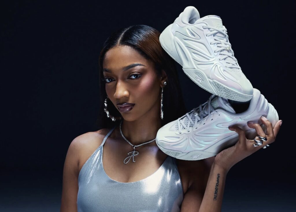 Angel Reese poses with her Reebok signature shoe.