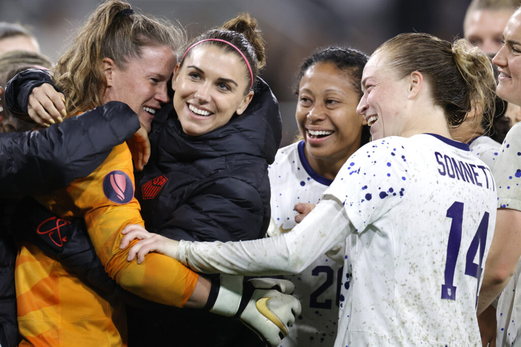 USWNT stars Alyssa Naeher, Alex Morgan, Casey Krueger, and Emily Sonnett celebrate their 2024 Concacaf Gold Cup semifinal win over Canada.