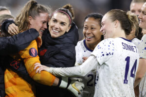 USWNT stars Alyssa Naeher, Alex Morgan, Casey Krueger, and Emily Sonnett celebrate their 2024 Concacaf Gold Cup semifinal win over Canada.
