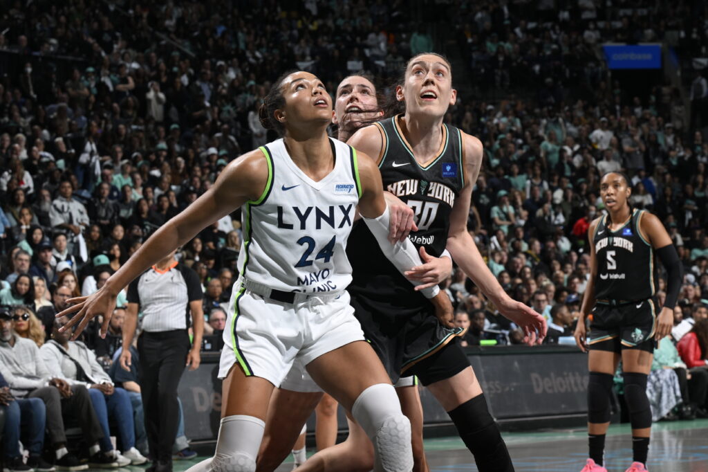 Minnesota Lynx star Napheesa Collier and New York Liberty standout Breanna Stewart eye a rebound during the 2024 WNBA Finals.