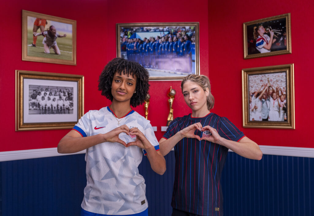 USWNT midfielders Lily Yohannes and Korbin Albert pose in the new 2025 US jerseys.