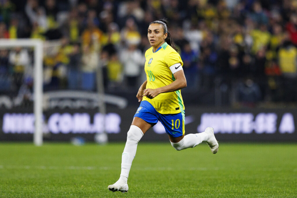 Legendary Brazil captain Marta runs across the pitch during a 2025 match.