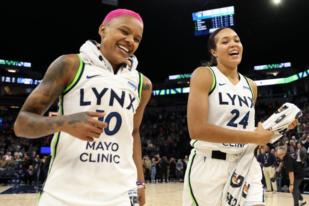 Minnesota Lynx All-Stars Courtney Williams and Napheesa Collier celebrate a 2025 WNBA regular-season win.