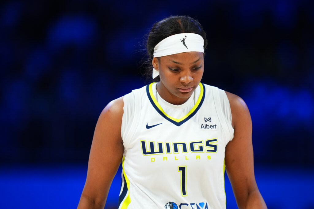 Dallas Wings forward NaLyssa Smith looks down during a 2025 WNBA game.