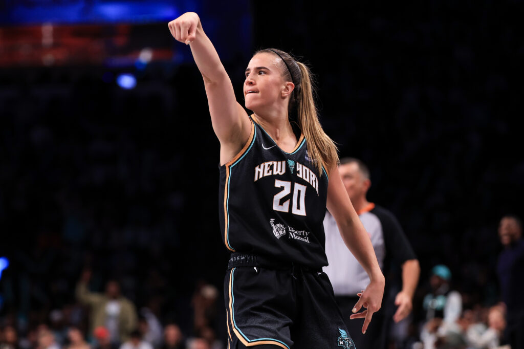 New York Liberty star Sabrina Ionescu sinks a three-pointer during a 2025 WNBA game.