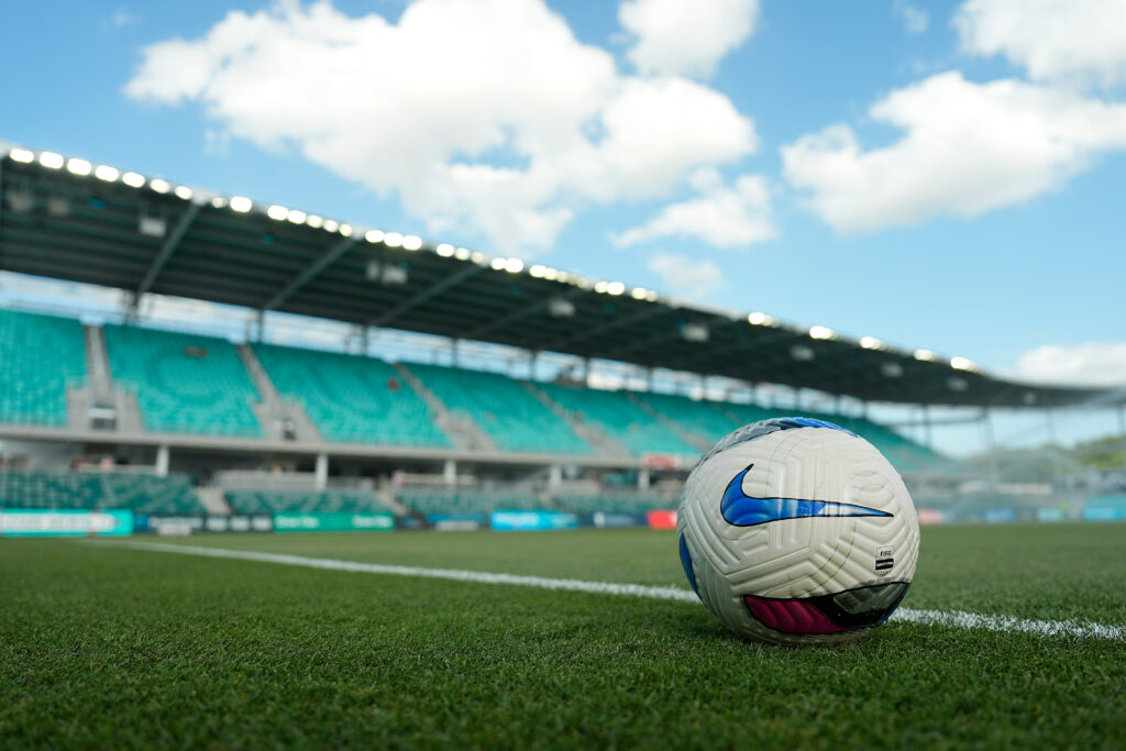 A soccer ball rests on the pitch at Kansas City's CPKC Stadium before a 2025 NWSL match.