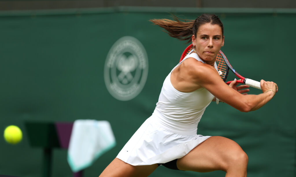 US tennis star Emma Navarro eyes a return during a 2025 Wimbledon match.