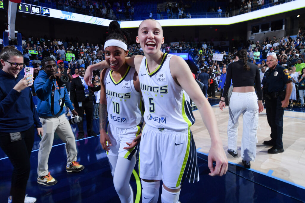 Dallas Wings rookies Aziaha James and Paige Bueckers celebrate a 2025 WNBA win.