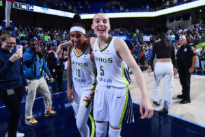 Dallas Wings rookies Aziaha James and Paige Bueckers celebrate a 2025 WNBA win.