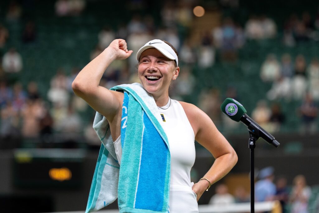 US tennis star Amanda Anisimova celebrates her 2025 Wimbledon Round of 16 win before addressing the London crowd.