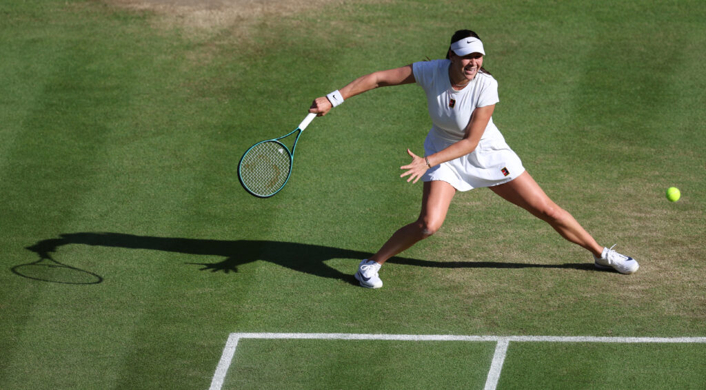 US tennis star Amanda Anisimova eyes the ball during her 2025 Wimbledon quarterfinal.