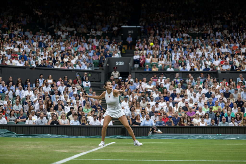 Aryna Sabalenka preps to return the ball during her 2025 Wimbledon Round of 16 match against Elise Mertens.