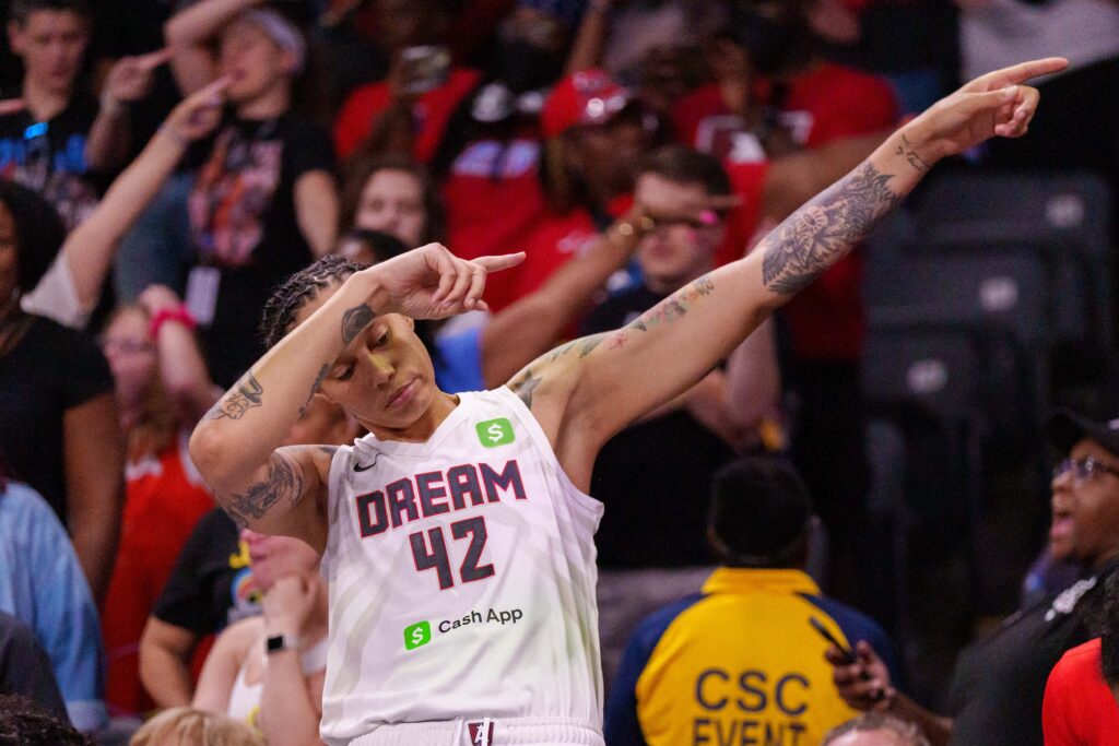 Atlanta Dream center Brittney Griner celebrates a turnover during a 2025 WNBA game.