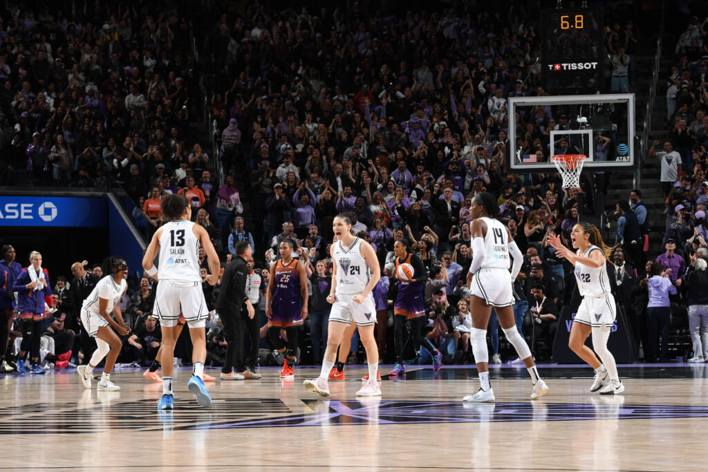 Forward Janelle Salaün celebrates her game-tying basket with her Golden State Valkyries teammates during a 2025 WNBA game.