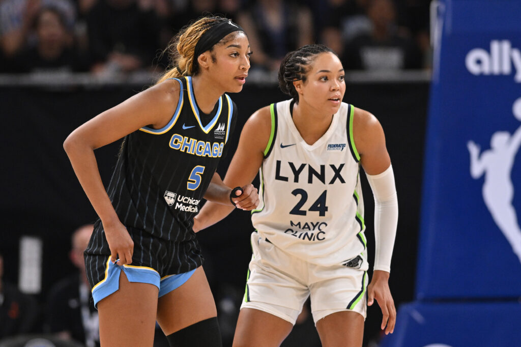 Chicago Sky star Angel Reese and Minnesota Lynx leader Napheesa Collier look on during a 2025 WNBA game.