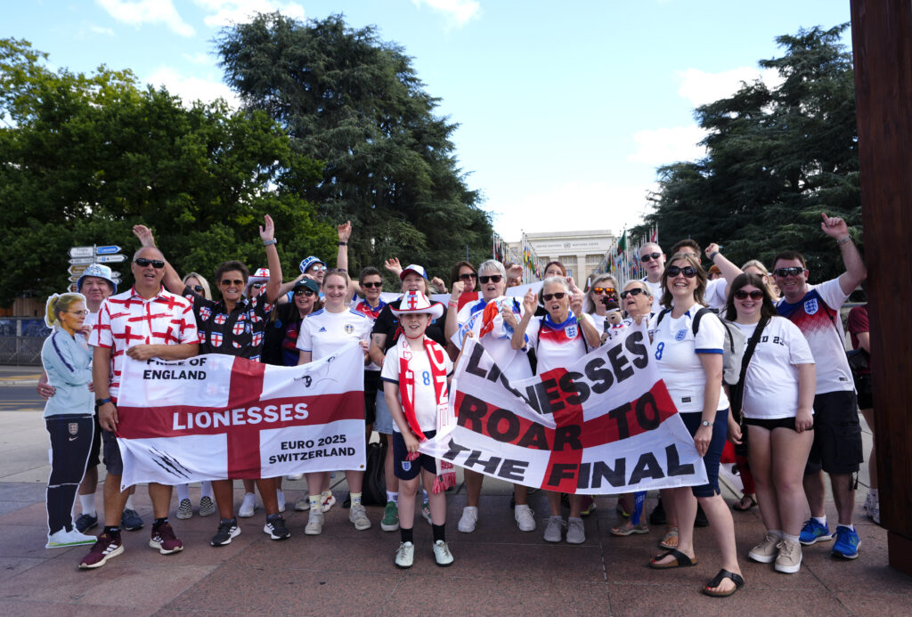 England fans pose for a photo while celebrating the Lionesses' upcoming 2025 Euro semifinal berth.