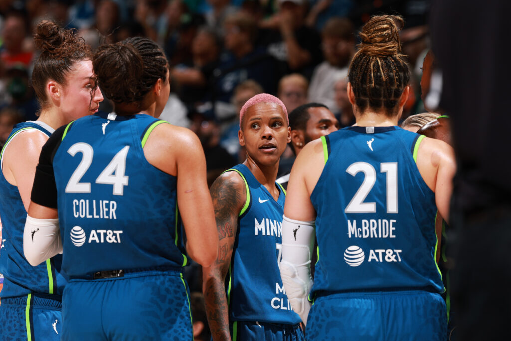 Courtney Williams huddles with her Minnesota Lynx teammates during a 2025 WNBA game.