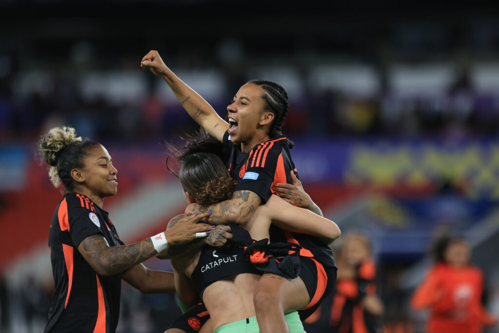 Colombia players celebrate their penalty shootout win over Argentina in the 2025 Copa América semifinals.