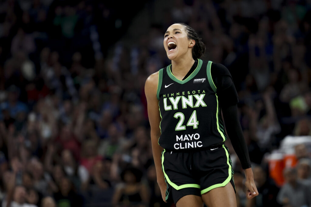 Minnesota Lynx star Napheesa Collier celebrates a three-pointer during a 2025 WNBA game.