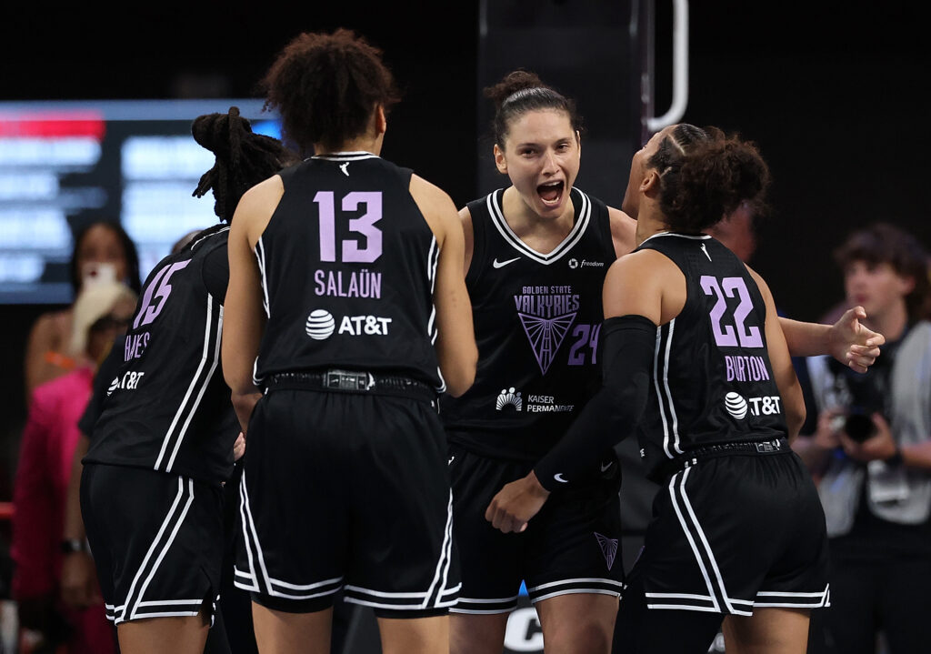 Golden State Valkyries forward Cecilia Zandalasini celebrates a 2025 WNBA win with her teammates.