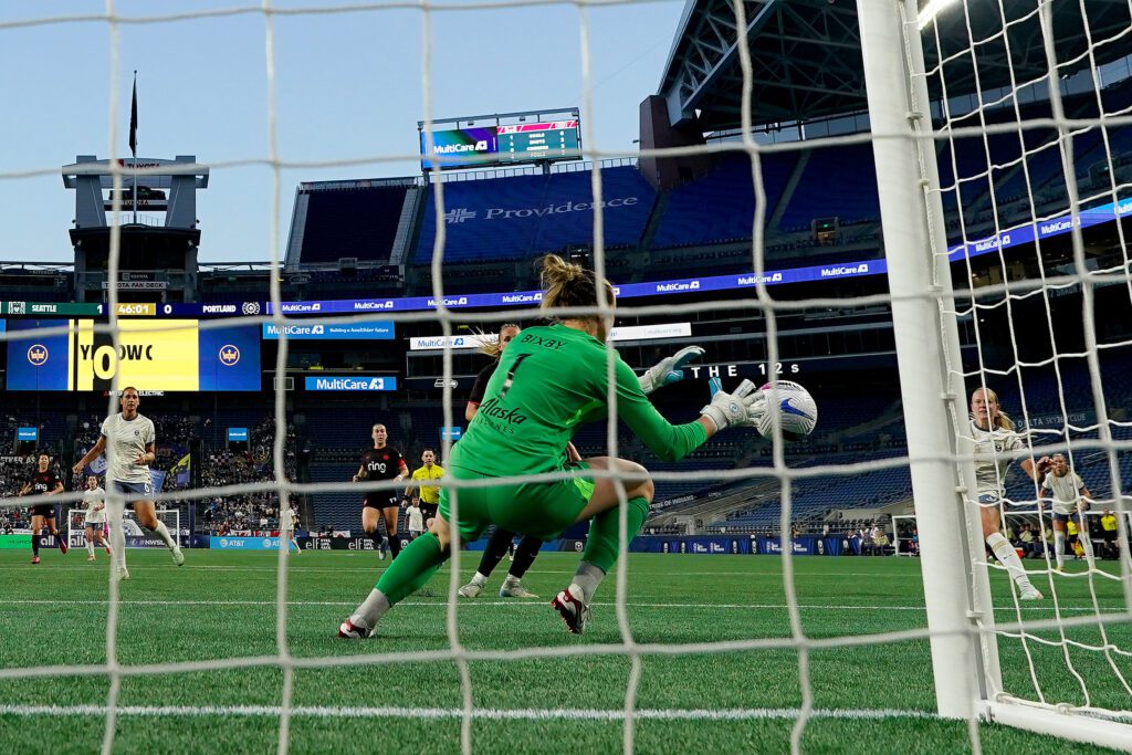 Portland Thorns goalkeeper Bella Bixby makes a save during a 2025 NWSL match.