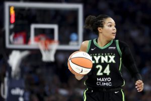 Minnesota Lynx star Napheesa Collier dribbles up the court during a 2025 WNBA game.