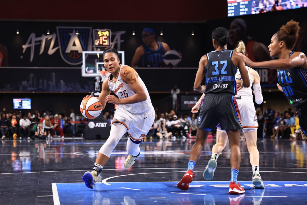 Phoenix Mercury forward Alyssa Thomas dribbles down the lane during a 2025 WNBA game.