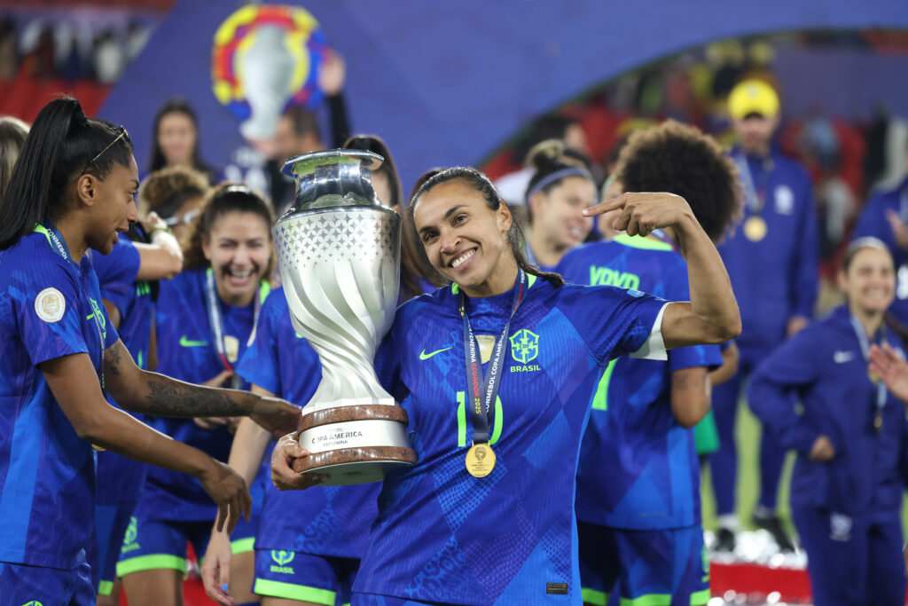 Brazil superstar Marta poses with the 2025 Copa América trophy.