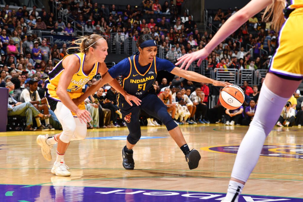 Indiana Fever guard Sydney Colson drives to the basket during a 2025 WNBA game.