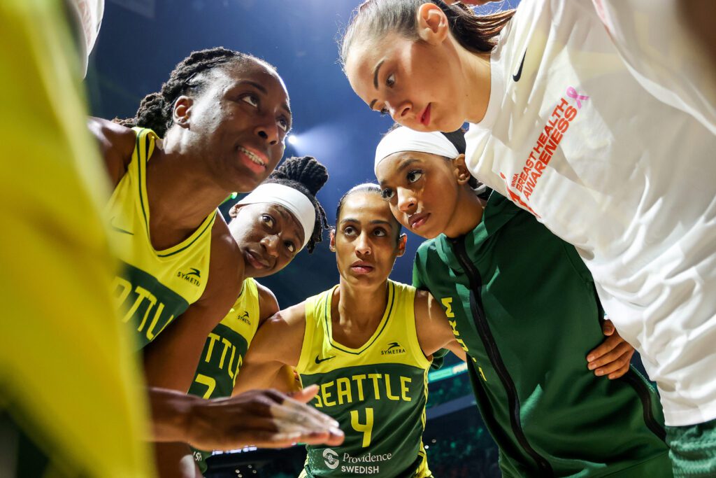 Nneka Ogwumike speaks to her Seattle Storm teammates in a huddle before a 2025 WNBA game.