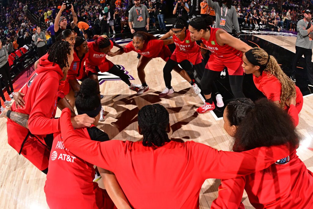 The Atlanta Dream huddle before a 2025 WNBA game.