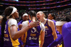 The LA Sparks celebrate a home win over the Seattle Storm during the 2025 WNBA season.