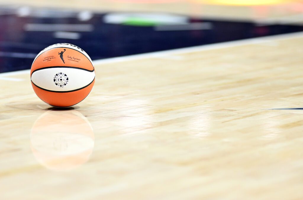 A basketball rests on the court during a 2025 WNBA game.